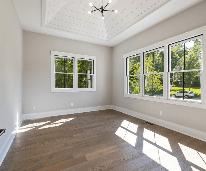 Empty move-in ready room with clean floors and windows